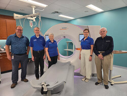(L-R) Mark Womack alongside a few of Kincardine & Community Health Care Foundation’s long-standing volunteers: Graham Mahood (Campaign co-chair), Carol Collins, Becky Fair (President), and Jack Nancekivell, standing with the Kincardine hospital’s CT scanner, installed in 2023.